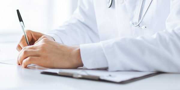 Doctor Writing on Paper